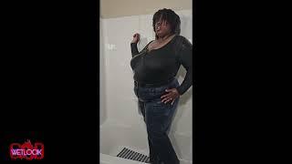 Wetlook Nubia in the shower in her dark grey shirt and jeans