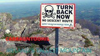 HIKING CARRAUNTOOHIL IRELAND'S TALLEST MOUNTAIN ON A SUNNY DAY.