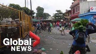 Second migrant caravan smashes through Mexico border as clashes erupt