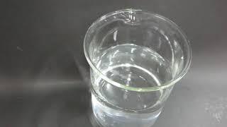 Sodium metal reacting with water in a beaker 1    MVI 1322