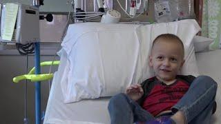 Boy battling rare cancer finishes chemo on 6th birthday, meets favorite heroes