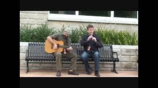 Larry Nugent and Patsy O'Brien perform on Floyd's Bench in Muskegon, MI