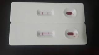 2 Hiv test kits showing positive results.