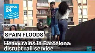 Heavy rains in Barcelona disrupt rail service as troops search for more flood victims in Valencia