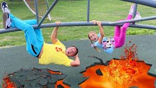 Sofia and Max are having fun playing on the playground with Dad