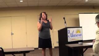 Sandy Anderson, 8z Real Estate, addresses Aurora Board of Realtors