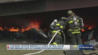 Large fire breaks out under Clemens Center Parkway Bridge