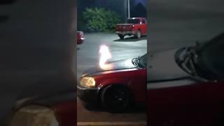 Car shoots flames out of hood