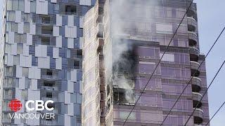 Apartment highrise fire in Vancouver's Coal Harbour sends debris flying