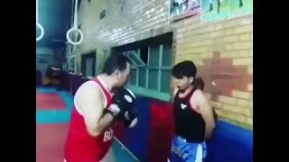 Kid battered by instructor - is this how you teach boxing?