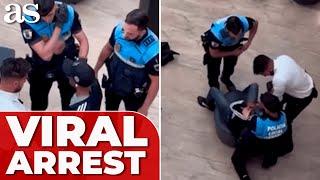 VIRAL ARREST: Two POLICE officers detain young man in SPAIN