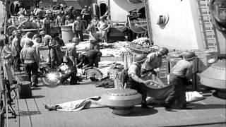 Wounded and dead US sailors removed from gun turret of the USS Savannah (CL-42) w...HD Stock Footage