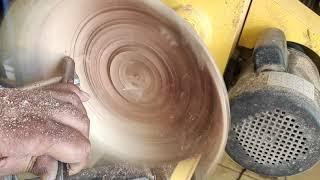 Wood turning a carob wood thin wall natural edge bowl