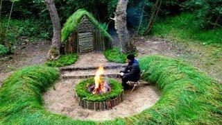 Building a shelter with a grass roof & clay fireplace.