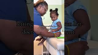 Nurse Listens Intently as Toddler Takes Charge of Own Medical Appointment