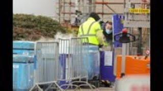 Workers deal with dry ice at Pfizer plant in Belgium