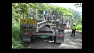 13 axle Cozad in Papua New Guinea going across a Truss bridge