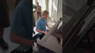 Movers moving in our son’s piano and then he gives them a performance of “Clocks” by Coldplay