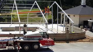 Losberger structure - flying in a 25m gable arch over a swimming pool