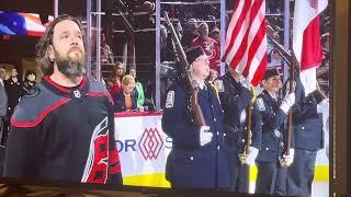 Adam Lee Decker performs the national anthem prior to BOS@CAR