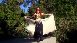 Metal bellydance. Sofia Goldberg (Sofia Metal Queen) of Ameynra. Black petal skirt, gold sequin veil