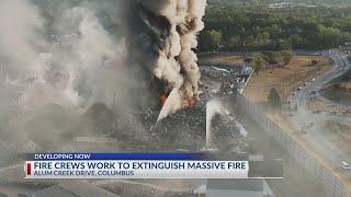 Fire crews work to extinguish massive fire in Columbus, Ohio