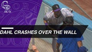 David Dahl crashes over the wall to make a tumbling catch