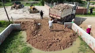 KOMATSU D20P Bulldozer and Trucks in Action: Filling Land with Precision!